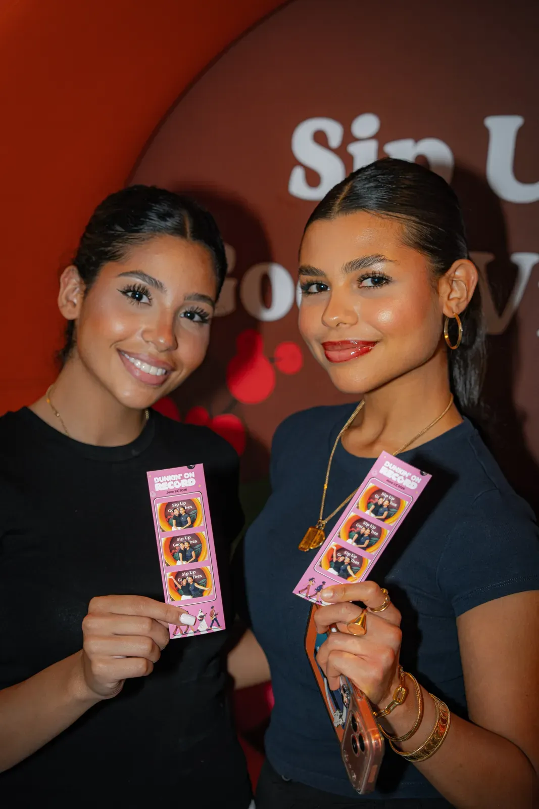 Two guests with their On Record photo strips