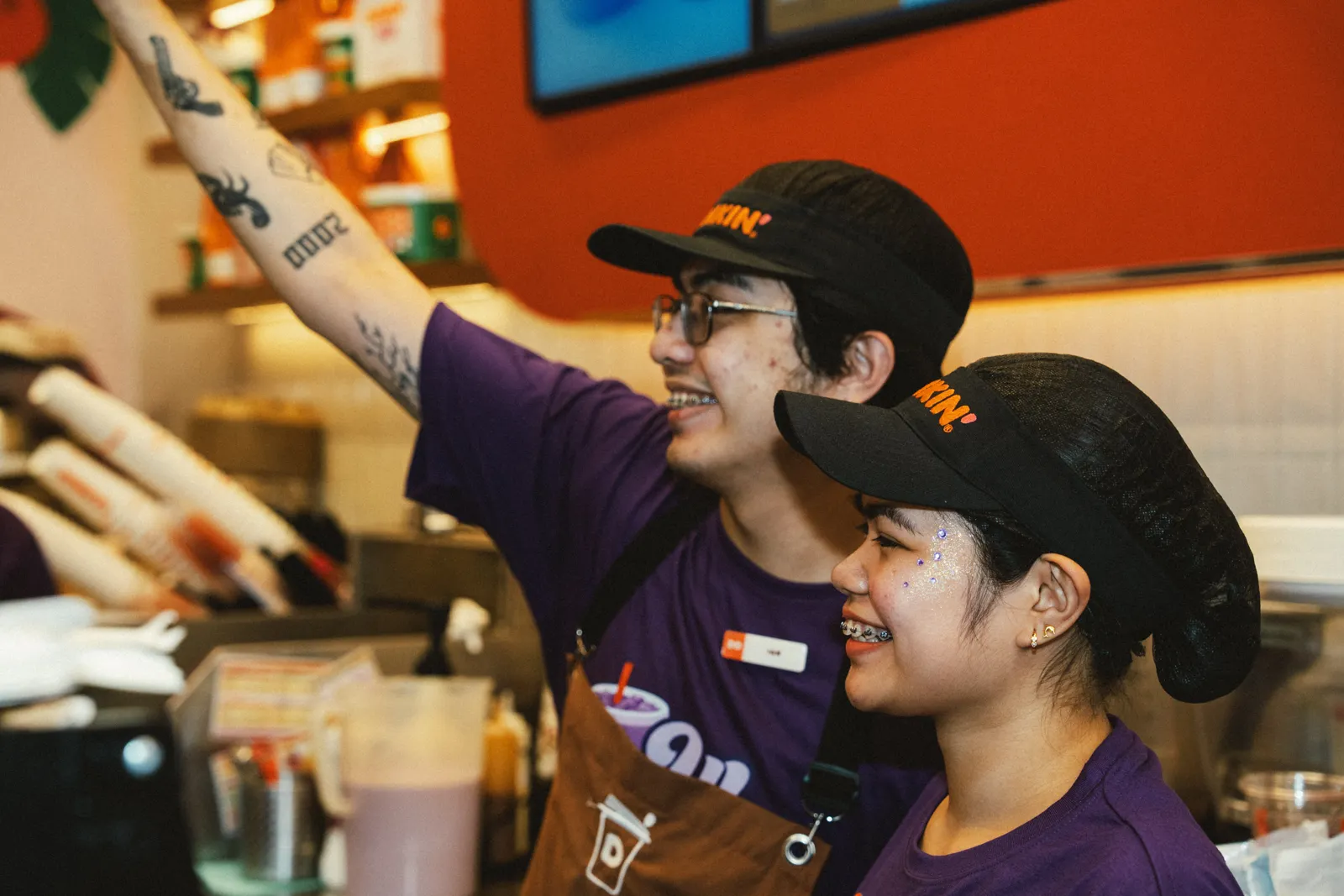 Crew energy · mid-shift hype behind the counter